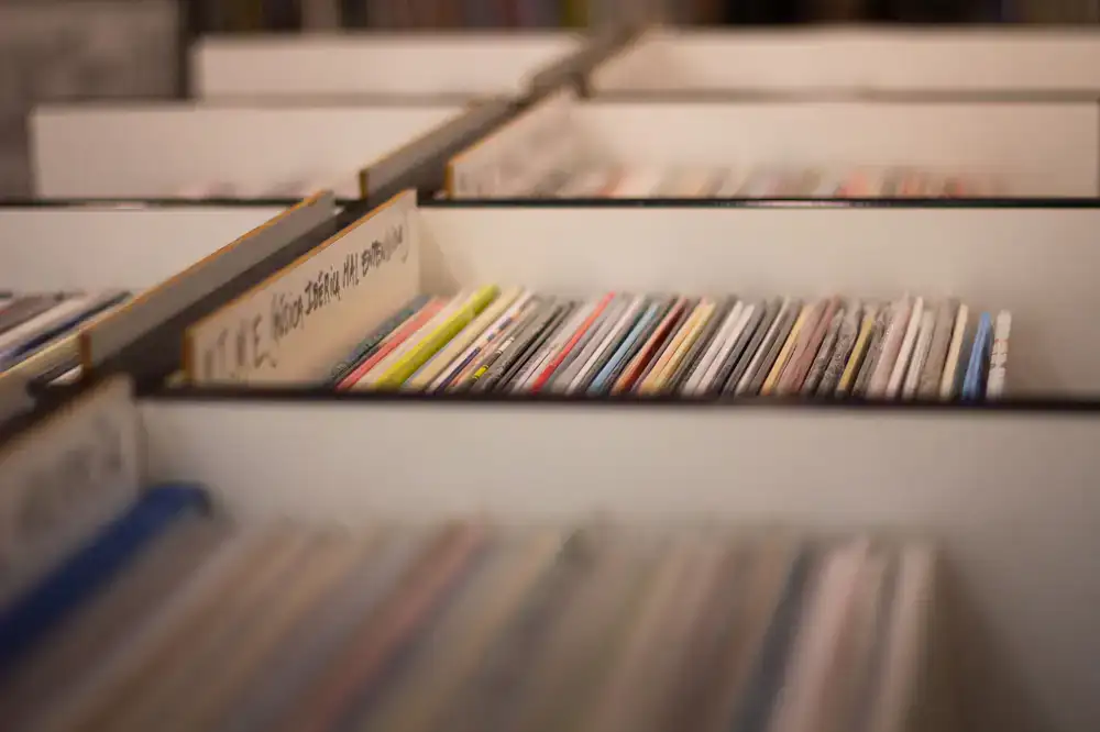 Fresh batch of vinyl records being unpacked from delivery boxes